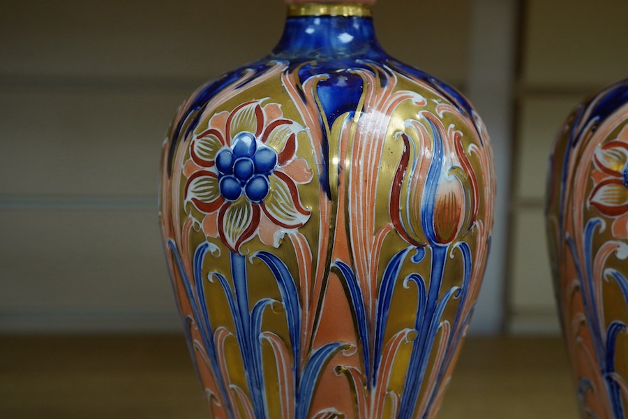 A pair of 'Alhambra', James Macintyre and Co vases, designed by William Moorcroft, 31cm high. Condition - one damaged and poorly repaired, the other in good condition with minor wear to the gilding